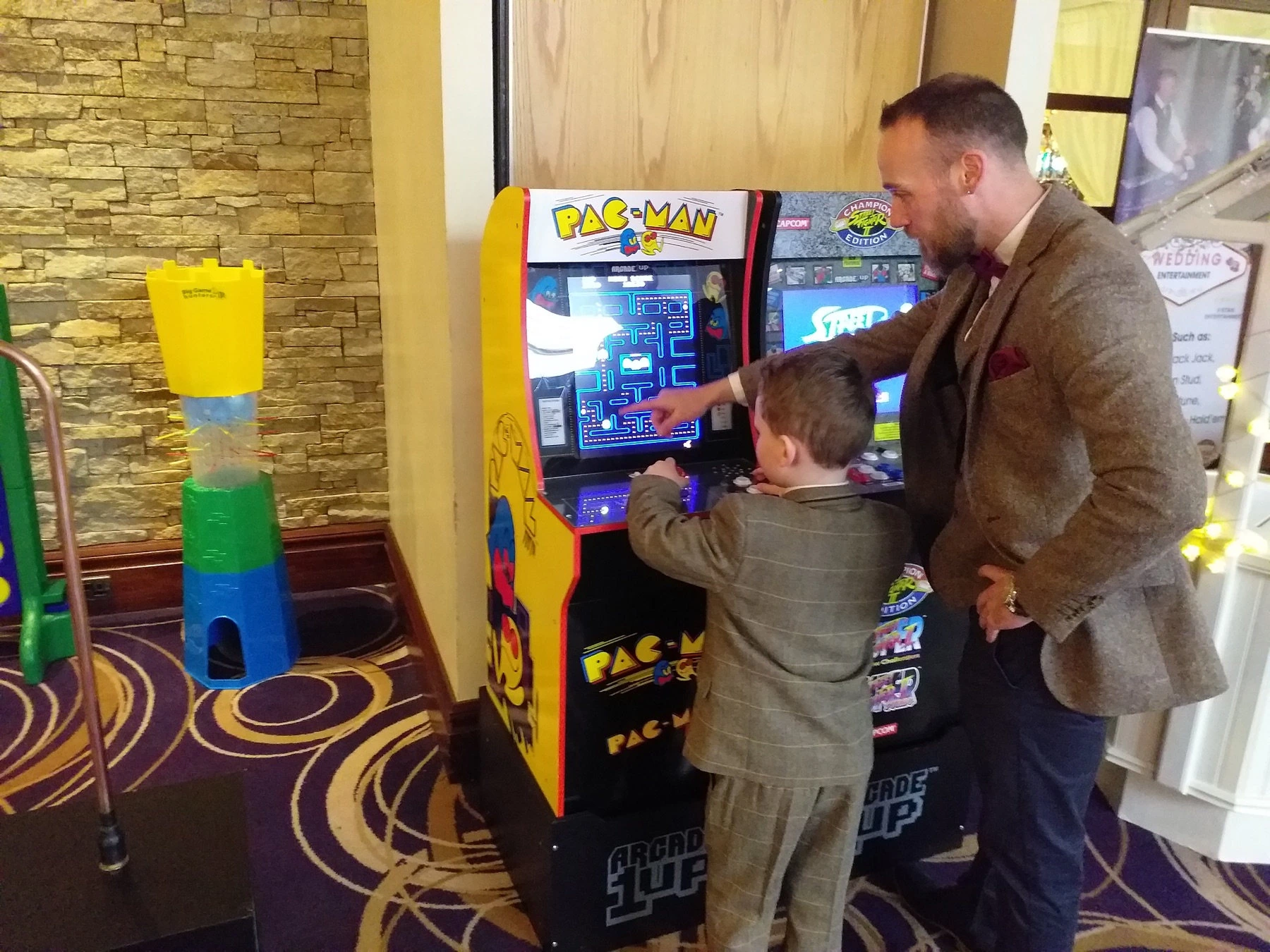 Guest enjoying a Pac-Man arcade game at an event