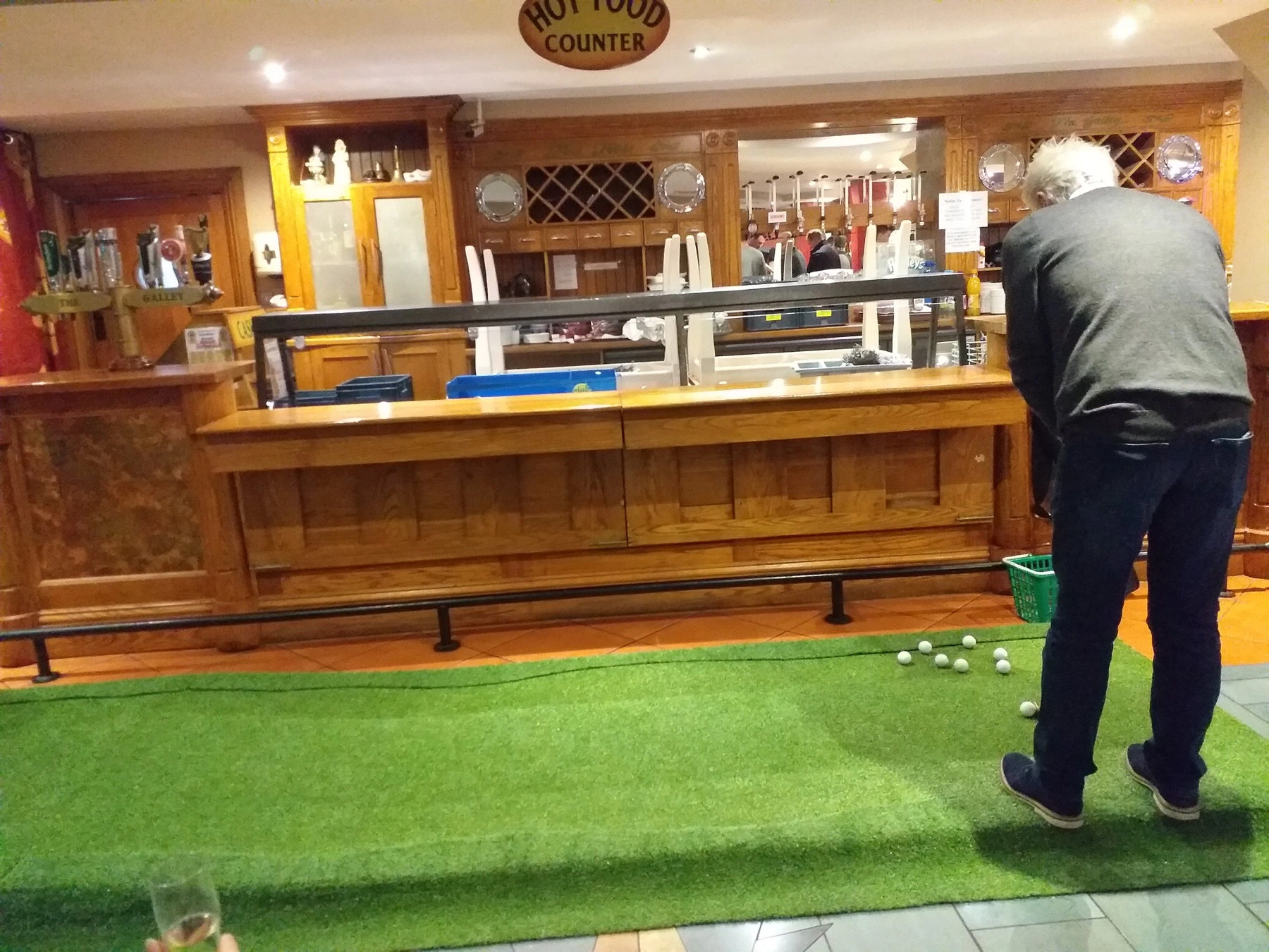 Guest putting on the Crazy Vegas mini golf lane