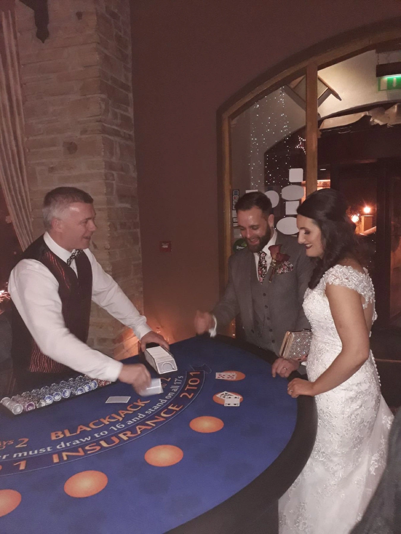 Bride and groom playing Blackjack with a Crazy Vegas dealer